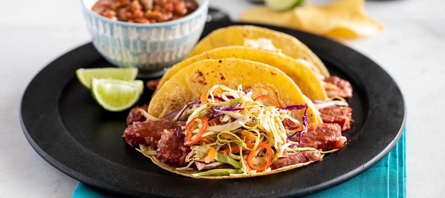 Stout Braised Corned Beef Tacos with Fiery Cabbage Slaw