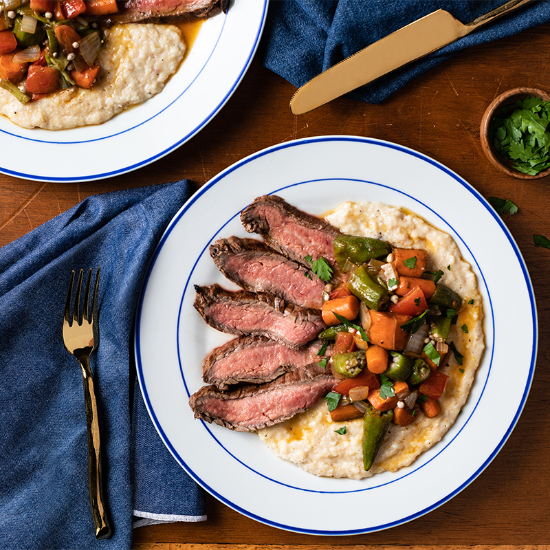 Creole Flank Steak with Sautéed Vegetables and Cheese Grits