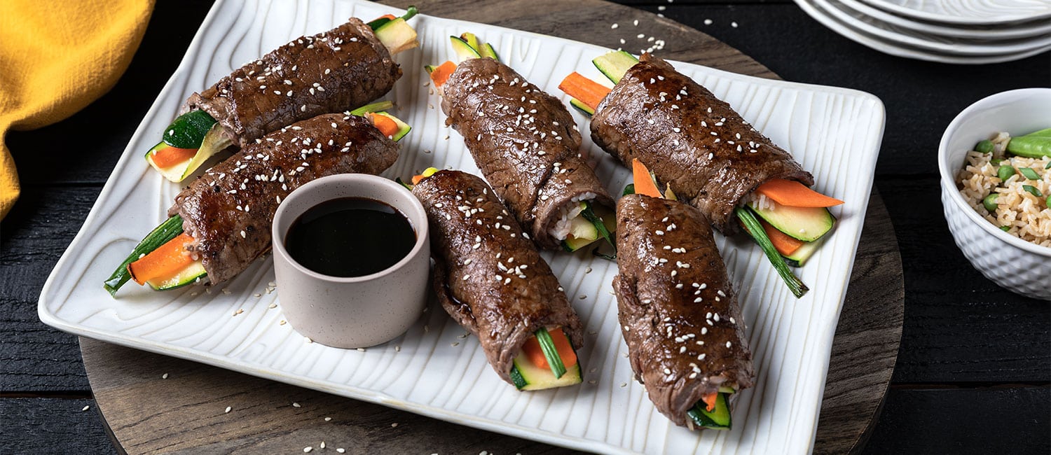 Beef and Veggie Rolls with Kecap Manis Glaze | Beef Loving Texans | Beef Loving Texans is your one-stop information center for beef recipes, cooking techniques and real life stories. Lean more about beef today. Brought to you by the Texas Beef Council.