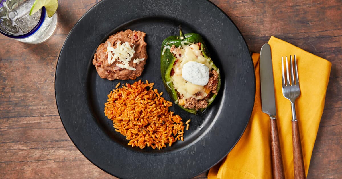Beef Picadillo Stuffed Peppers with Mexican Rice and Refried Beans | Beef Loving Texans | Beef Lovin